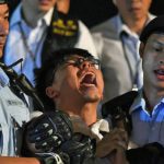 L’attivista di Hong Kong Joshua Wong arrestato dalla polizia prima della visita di Xi