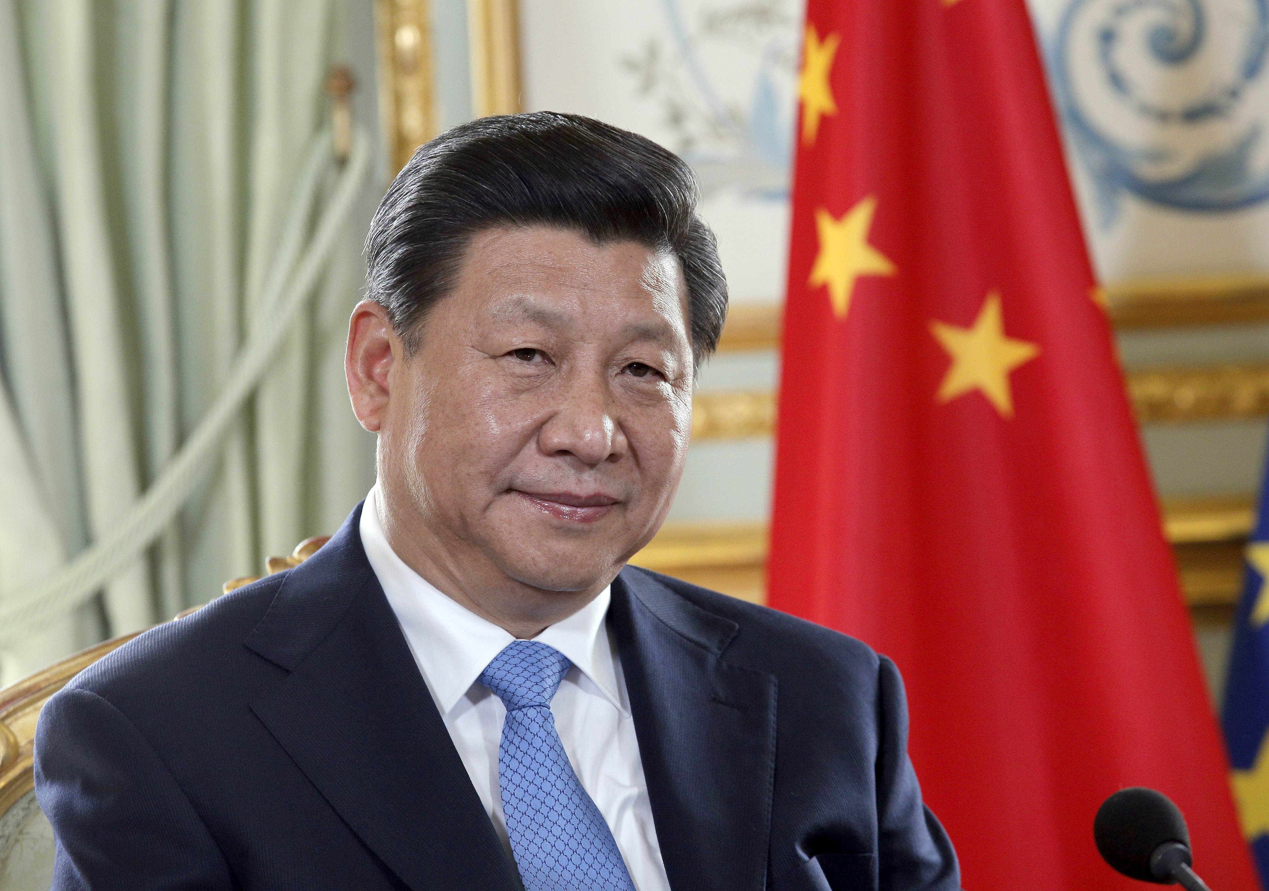 Chinese President Xi Jinping takes part in a meeting with his French counterpart at the Elysee Palace in Paris, on March 26, 2014 in Paris. Xi was set today to sign a series of major business deals on the second day of a lavish state visit to France. Xi is on his first-ever European tour and after visiting The Netherlands and France will head to Germany and Belgium. AFP PHOTO POOL CHRISTOPHE ENA